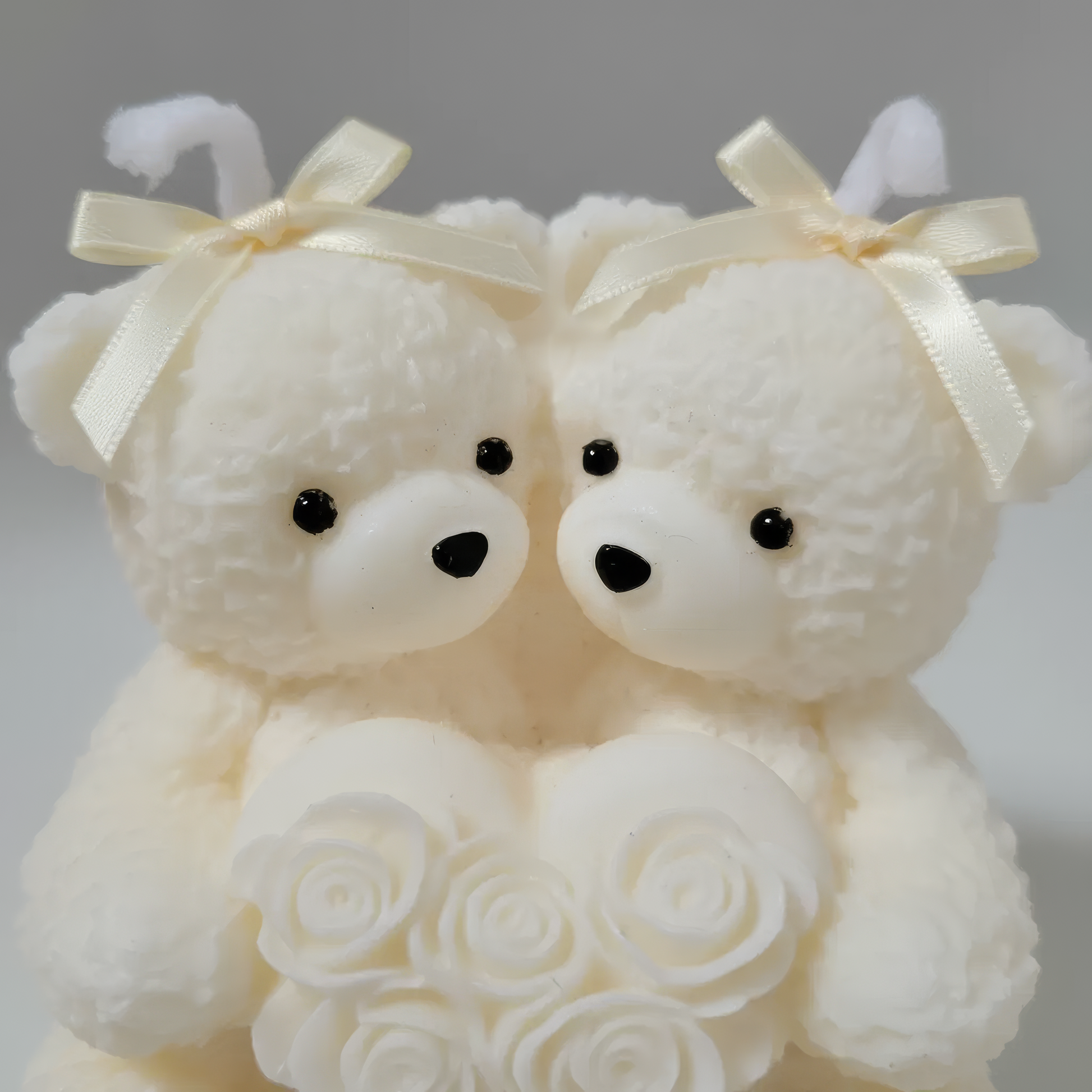 Sculptural Love Bears White Candle Gift - Valentine's Day Gift. Two teddy bears couple lovers carved handmade soy wax candle. Close - up photo.
