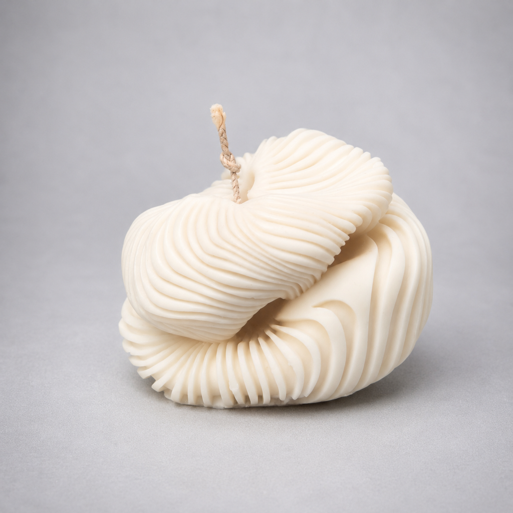 Ivory Ethereal Fold Pillar Candle with layered ribbed curves on a soft grey background