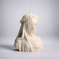Veiled Vestal handmade sculptural candle inspired by classical art, large ivory sculpture candle with floral crown and flowing drapery, luxury home decor. Warm Warren London