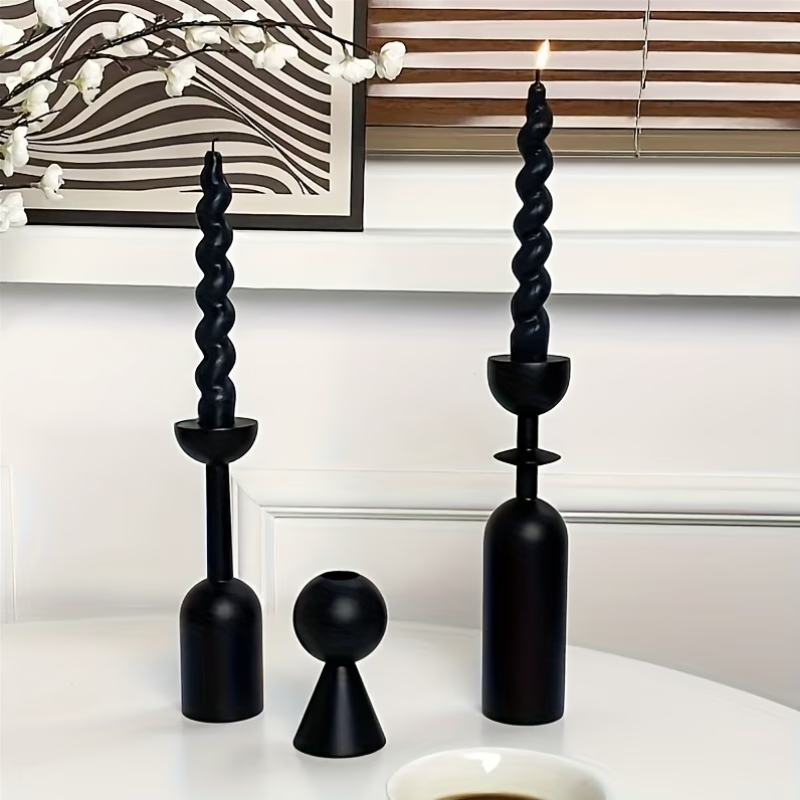 Black twisted candle holders on a white surface  for showing Elegant Black Wooden Candle Holders –  Set of 3 Candle Accessories
