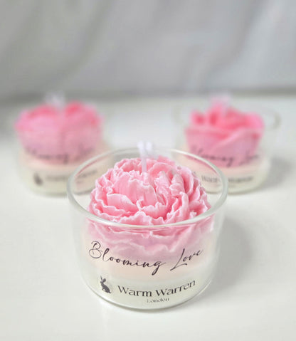 Warm Warren London Blooming Love, handmade soy wax Candle Flower in Glass container peony flower close-up studio photo. Valentines day, mothers day gift set
